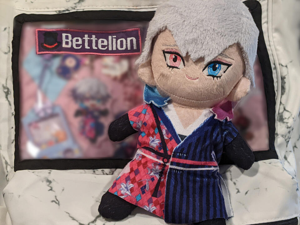 Bettel plush doll on an ita bag with a Bettelion patch